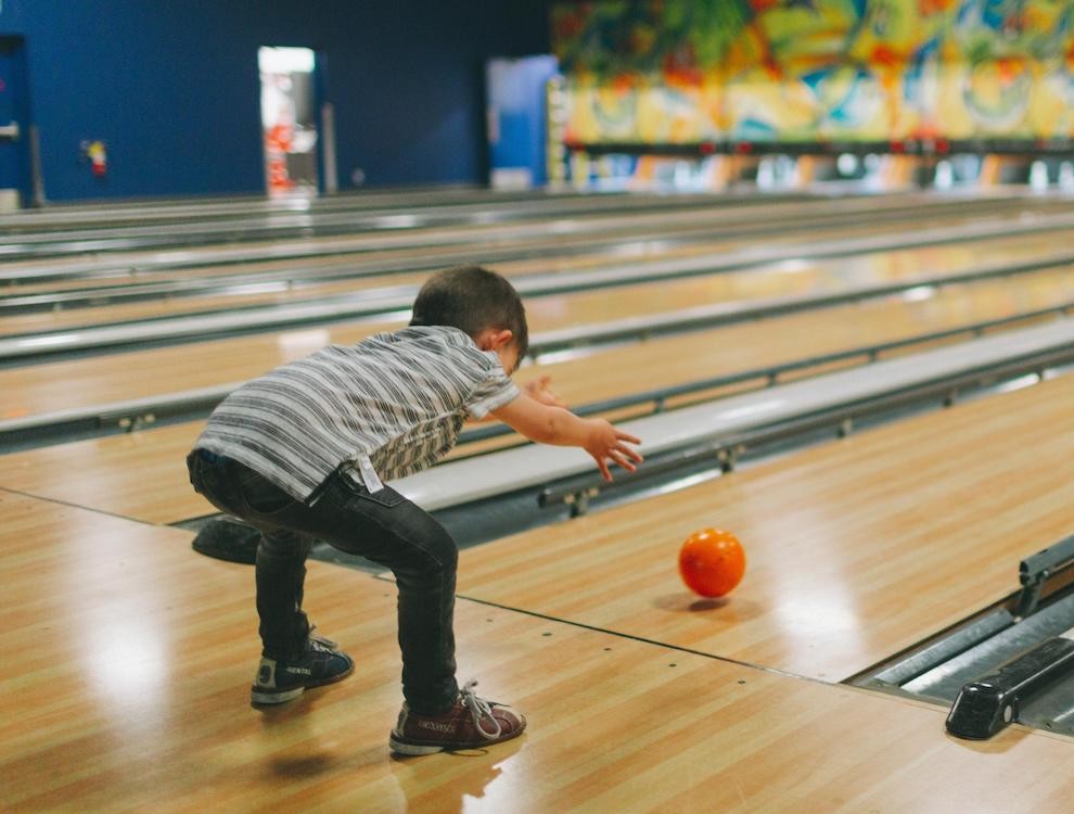 Image showin child bowling